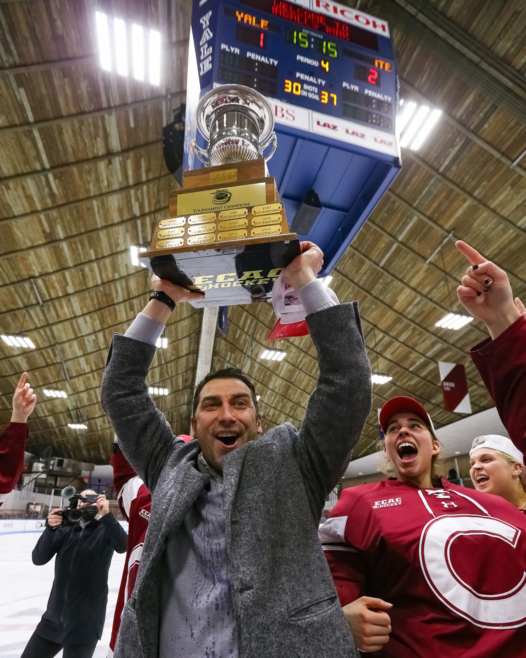 Greg Fargo holding the ECAC championship trophy with Colgate