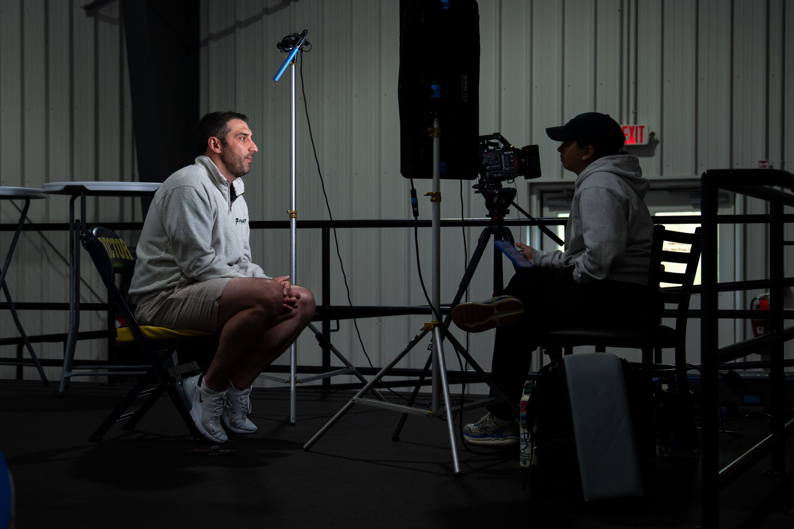 Camp coach being interviewed on camera